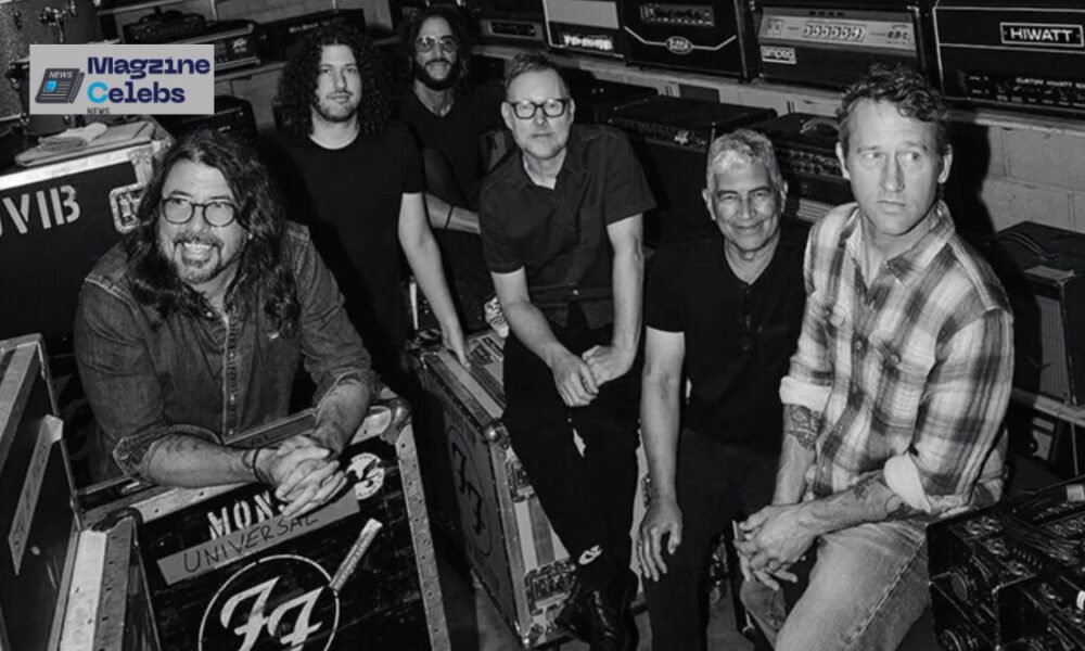The members of Foo Fighters, including Dave Grohl, backstage with their equipment cases.