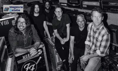 The members of Foo Fighters, including Dave Grohl, backstage with their equipment cases.