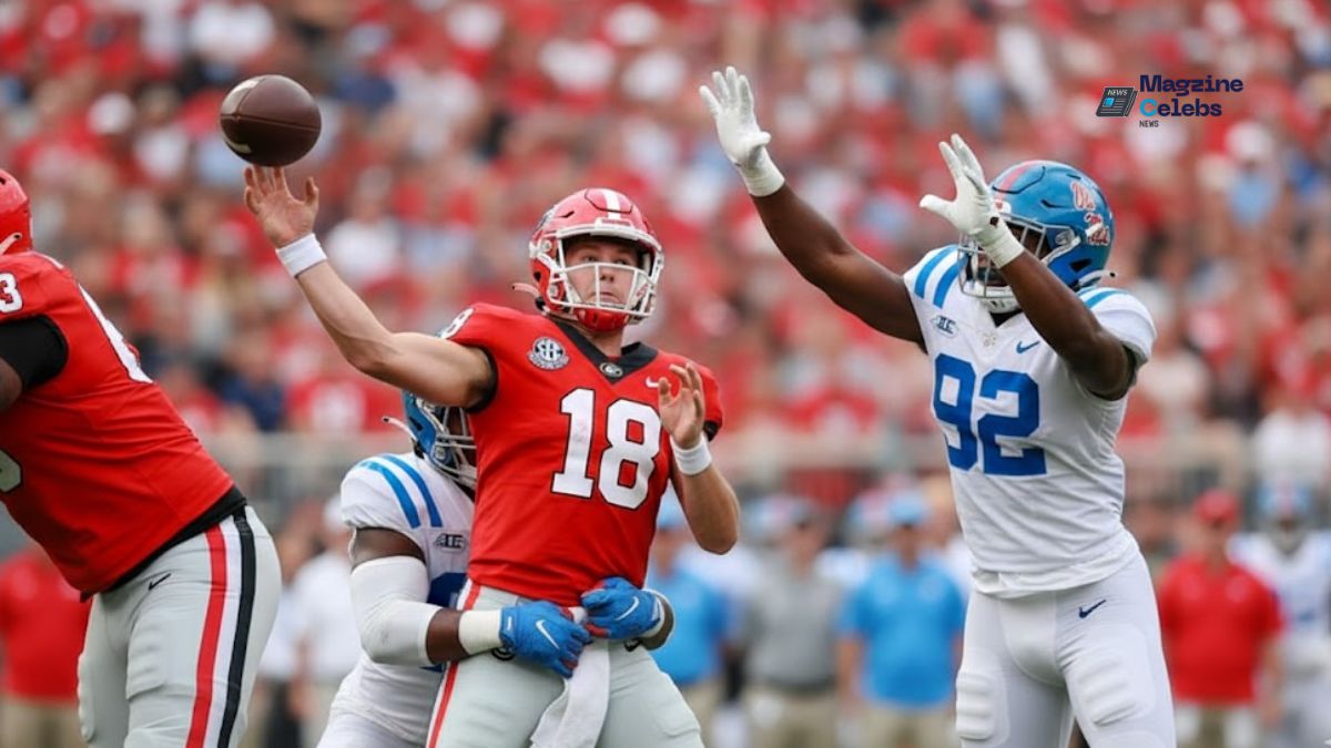Action shot from the Georgia vs. Ole Miss game showing a Bulldogs player in a red jersey breaking a tackle from a Rebels defender, highlighting the intensity of their comeback victory.