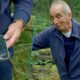 Kevin McCloud reacts after his phone is crushed by a falling tree branch during Grand Designs filming