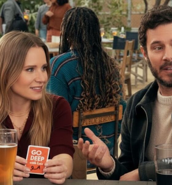 Bell and Adam Brody in a scene from the Netflix series 'Nobody Wants This', sitting at a table.